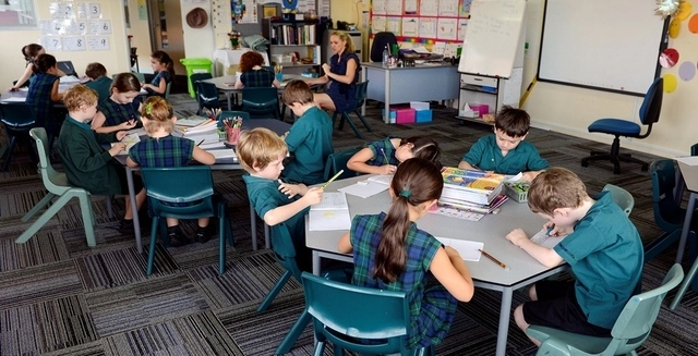 teacher taking class in classroom 